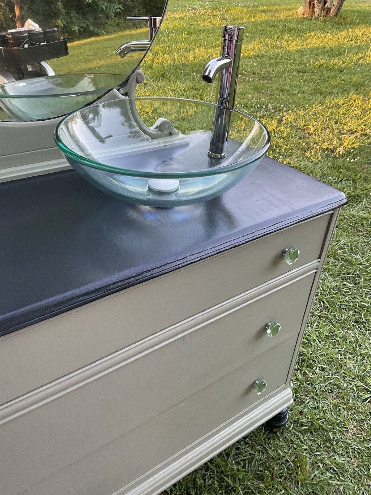 Green & Gray Dresser Repurposed Into Bathroom Vanity With Clear Glass Sink