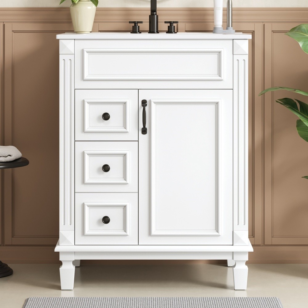Bathroom vanity W ceramic sink Features two drawers Includes adjustable shelves