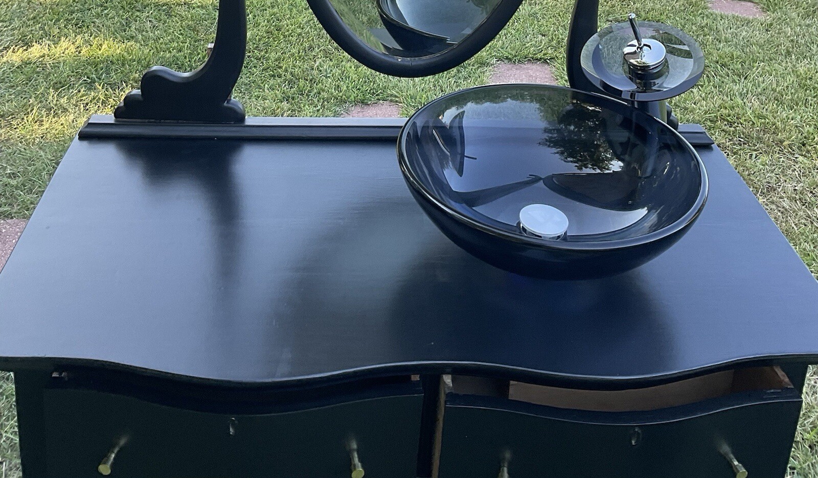 Antique Princess Dresser converted to bathroom vanity with black sink and faucet